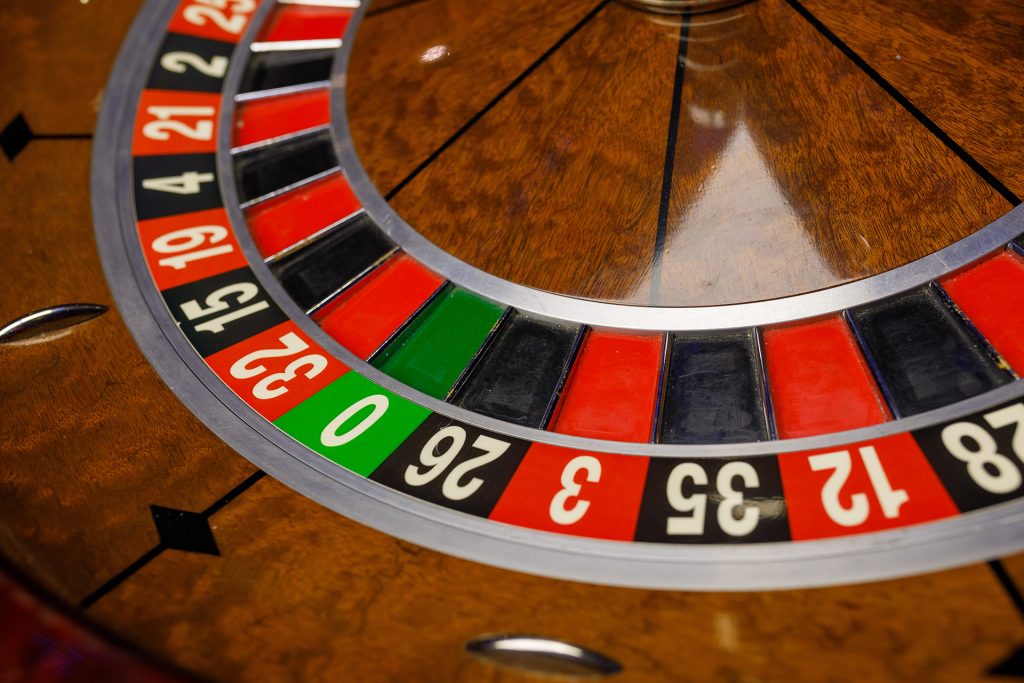 A close-up of a roulette wheel in a casino 

