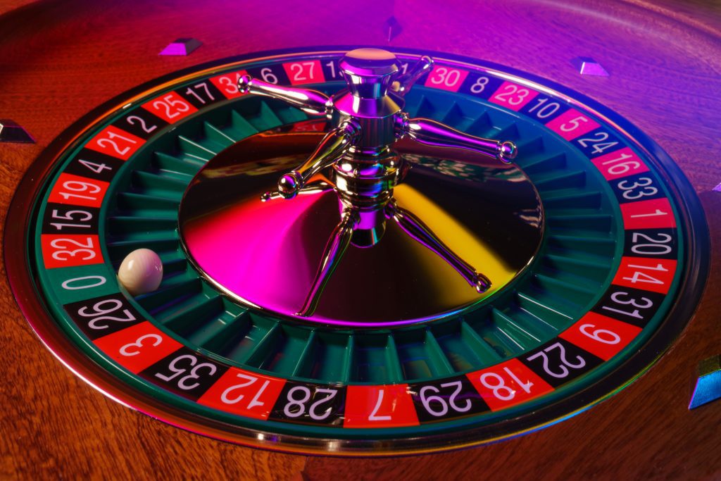 A spinning roulette wheel in a casino 
