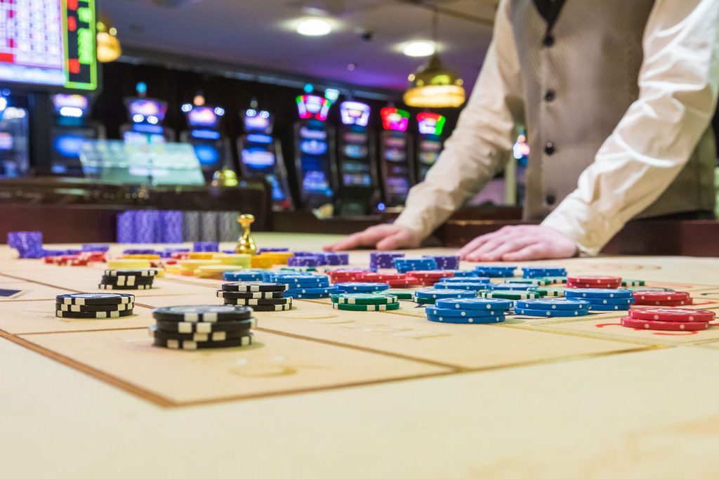 A Roulette Croupier behind a roulette table
