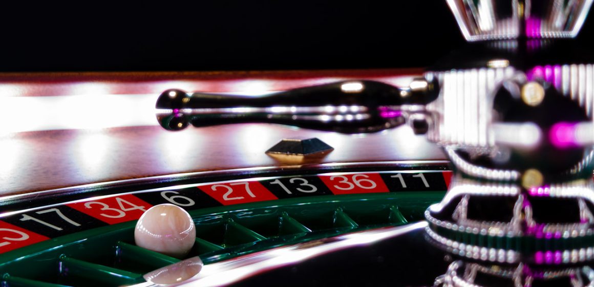 Roulette players in a casino.