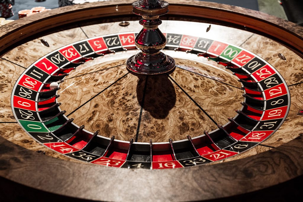 Roulette players spinning wheel
